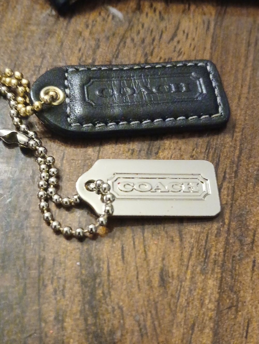 Coach Men's Black Leather and Silver Metal Hang Tag Keychain